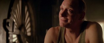 Movie still from “Alien³” (1992), directed by David Fincher – A person wearing a tank top; Close Up shot, Over the shoulder angle