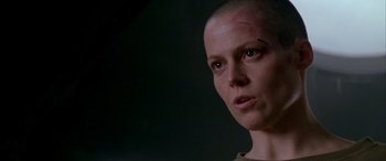 Movie still from “Alien³” (1992), directed by David Fincher – A person with a shaved head; Close Up shot, Low angle