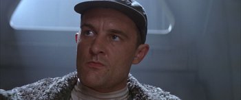 Movie still from “Alien³” (1992), directed by David Fincher – A person wearing a hat; Close Up shot, Low angle