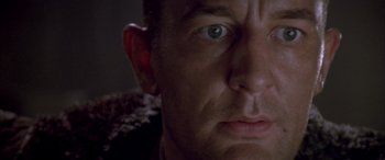 Movie still from “Alien³” (1992), directed by David Fincher – A man's face with a lot of light coming through the window; Extreme Close Up shot, Low angle