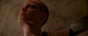 Movie still from “Alien³” (1992), directed by David Fincher – A person looking up at the sky; Close Up shot, Low angle