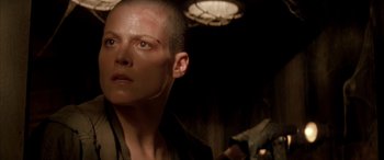 Movie still from “Alien³” (1992), directed by David Fincher – A person in a dark room; Close Up shot, Over the shoulder angle