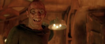 Movie still from “Alien³” (1992), directed by David Fincher – A man with a big smile on his face; Close Up shot, Low angle