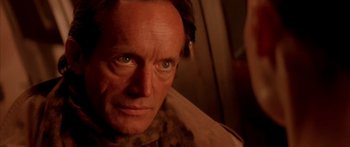 Movie still from “Alien³” (1992), directed by David Fincher – A person wearing a jacket; Close Up shot, High angle