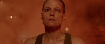 Movie still from “Alien³” (1992), directed by David Fincher – A person wearing a tank top and looking up; Close Up shot, Low angle