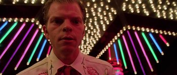 Movie still from “Fear and Loathing in Las Vegas” (1998), directed by Terry Gilliam – A person wearing a shirt and tie; Close Up shot, Low angle