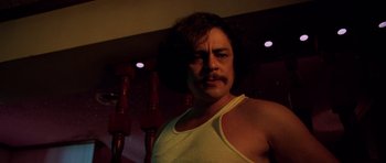 Movie still from “Fear and Loathing in Las Vegas” (1998), directed by Terry Gilliam – A person wearing a tank top; Close Up shot, Low angle