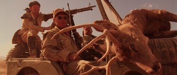 Movie still from “Fear and Loathing in Las Vegas” (1998), directed by Terry Gilliam – Two men riding in the back of a truck; Medium shot, Low angle