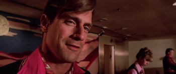 Movie still from “Fear and Loathing in Las Vegas” (1998), directed by Terry Gilliam – A man's face in a dark room; Close Up shot, Low angle