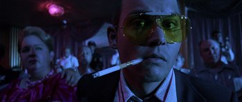 Movie still from “Fear and Loathing in Las Vegas” (1998), directed by Terry Gilliam – A man with a cigarette in his mouth; Close Up shot, Low angle