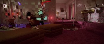 Movie still from “Fear and Loathing in Las Vegas” (1998), directed by Terry Gilliam – A living room filled with furniture next to a window; Wide shot, High angle