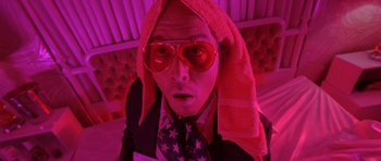 Movie still from “Fear and Loathing in Las Vegas” (1998), directed by Terry Gilliam – A man with a towel on his head and sunglasses on; Close Up shot, Low angle