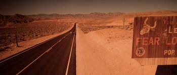 Movie still from “Fear and Loathing in Las Vegas” (1998), directed by Terry Gilliam – An empty road in the middle of the desert; Extreme Wide shot, High angle