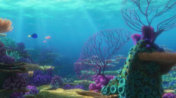 Movie still from “Finding Dory” (2016), directed by Angus MacLane – An underwater view of a coral reef with fish swimming in the water; Extreme Wide shot, High angle