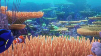Movie still from “Finding Dory” (2016), directed by Angus MacLane – An underwater view of a coral reef with a clown fish swimming in the foreground; Extreme Wide shot, High angle