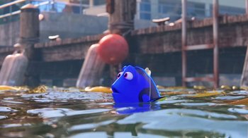 Movie still from “Finding Dory” (2016), directed by Angus MacLane – A toy fish is floating in the water near a ball; Wide shot, High angle