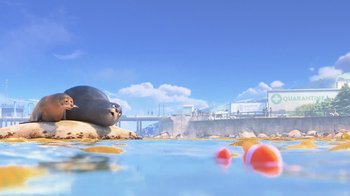 Movie still from “Finding Dory” (2016), directed by Angus MacLane – An animal laying on top of a beach next to a body of water; Extreme Wide shot, Low angle