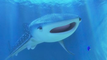 Movie still from “Finding Dory” (2016), directed by Angus MacLane – A whale shark is swimming in the blue water; Medium shot, Low angle