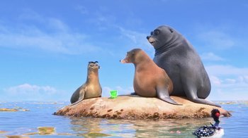 Movie still from “Finding Dory” (2016), directed by Angus MacLane – A group of sea lions sitting on top of a rock in the water; Wide shot, Low angle