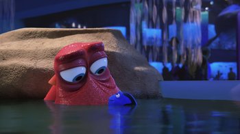 Movie still from “Finding Dory” (2016), directed by Angus MacLane – A toy fish in the water; Medium shot, Over the shoulder angle