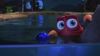 Movie still from “Finding Dory” (2016), directed by Angus MacLane – A toy fish and an octopus in a body of water at night; Close Up shot, Over the shoulder angle