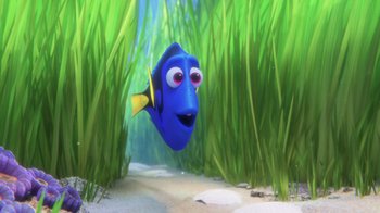 Movie still from “Finding Dory” (2016), directed by Angus MacLane – A blue and yellow fish in the grass; Medium shot, Over the shoulder angle