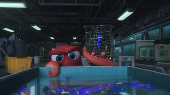 Movie still from “Finding Dory” (2016), directed by Angus MacLane – An image of an octopus and an aquarium in a room; Wide shot, Over the shoulder angle