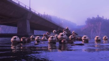 Movie still from “Finding Dory” (2016), directed by Angus MacLane – A group of sea otters floating on top of a body of water near a bridge; Extreme Wide shot, Low angle