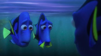 Movie still from “Finding Dory” (2016), directed by Angus MacLane – A couple of blue fish are swimming in the water; Medium shot, Over the shoulder angle