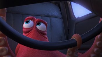 Movie still from “Finding Dory” (2016), directed by Angus MacLane – An octopus is sitting in a car with a steering wheel; Close Up shot, High angle