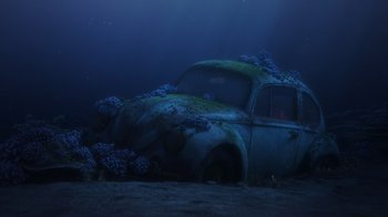 Movie still from “Finding Dory” (2016), directed by Angus MacLane – An old rusted car is submerged in the water; Wide shot, High angle