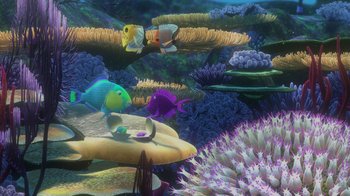 Movie still from “Finding Nemo” (2003), directed by Andrew Stanton – An underwater scene with a bunch of fish in the water; Wide shot, High angle