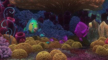 Movie still from “Finding Nemo” (2003), directed by Andrew Stanton – An underwater scene with a bunch of fish in the water; Wide shot, High angle
