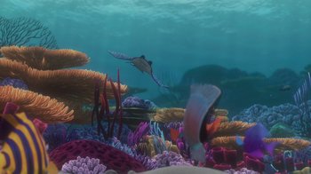 Movie still from “Finding Nemo” (2003), directed by Andrew Stanton – An underwater view of a coral reef with a manta ray and other fish swimming; Extreme Wide shot, High angle