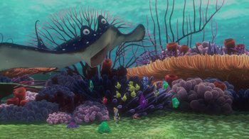 Movie still from “Finding Nemo” (2003), directed by Andrew Stanton – An underwater scene with a shark and a bunch of fish; Extreme Wide shot, High angle