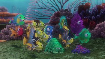 Movie still from “Finding Nemo” (2003), directed by Andrew Stanton – A group of colorful sea creatures in a coral reef; Wide shot, High angle
