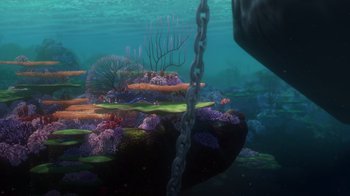 Movie still from “Finding Nemo” (2003), directed by Andrew Stanton – An underwater view of a coral reef with a chain hanging from it's side; Extreme Wide shot, High angle