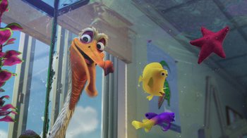 Movie still from “Finding Nemo” (2003), directed by Andrew Stanton – A group of fish swimming in a pool of water next to a window; Wide shot, Low angle