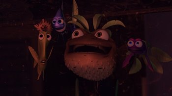 Movie still from “Finding Nemo” (2003), directed by Andrew Stanton – A group of cartoon characters hanging on a wall; Medium shot, High angle