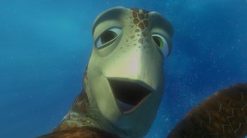 Movie still from “Finding Nemo” (2003), directed by Andrew Stanton – The head of a sea turtle in the water; Close Up shot, Low angle
