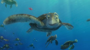 Movie still from “Finding Nemo” (2003), directed by Andrew Stanton – A group of sea turtles swimming in the ocean; Medium shot, Low angle