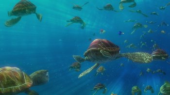 Movie still from “Finding Nemo” (2003), directed by Andrew Stanton – A group of sea turtles swimming under the water; Extreme Wide shot, High angle