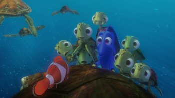 Movie still from “Finding Nemo” (2003), directed by Andrew Stanton – A group of sea turtles and a clown fish in the water; Wide shot, High angle