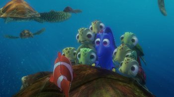 Movie still from “Finding Nemo” (2003), directed by Andrew Stanton – A group of fish in the water next to each other; Extreme Wide shot, High angle