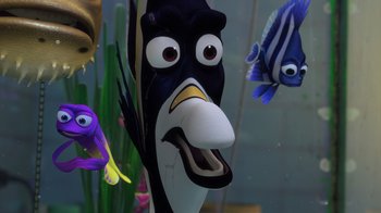 Movie still from “Finding Nemo” (2003), directed by Andrew Stanton – A fish in the water with other fish in the background; Close Up shot, High angle