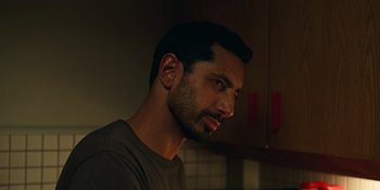 Movie still from “Fingernails” (2023), directed by Christos Nikou – A person in a room; Close Up shot, Over the shoulder angle