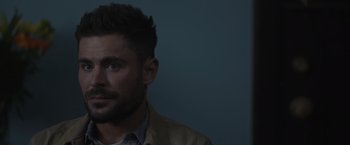 Movie still from “Firestarter” (2022), directed by Keith Thomas – A person wearing a jacket; Close Up shot, Over the shoulder angle