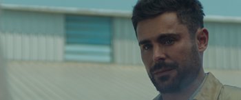 Movie still from “Firestarter” (2022), directed by Keith Thomas – A person with a beard; Close Up shot, Over the shoulder angle