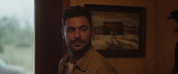 Movie still from “Firestarter” (2022), directed by Keith Thomas – A person wearing a jacket; Close Up shot, Over the shoulder angle