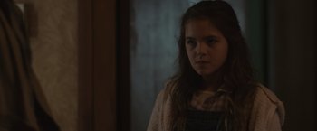 Movie still from “Firestarter” (2022), directed by Keith Thomas – A young girl standing in front of a mirror; Close Up shot, Over the shoulder angle